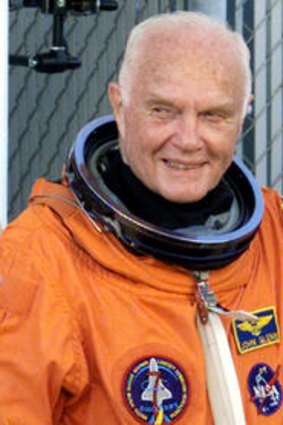 A new mission ... John Glenn, at 77, waves with crewmates as they depart crew quarters for the launchpad at the Kennedy Space Centre on October 29, 1998.