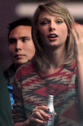 Recently spotted ... Taylor Swift watches backstage as Calvin Harris performs in Los Angeles.
