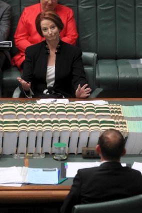 Prime Minister Julia Gillard and Opposition Leader Tony Abbott during question time yesterday.