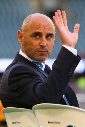 Kevin Muscat waves to fans during the match against Wellington Phoenix.
