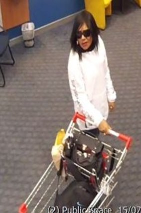 Police are looking for a woman to help with inquiries about a robbery in a Belmont bank.