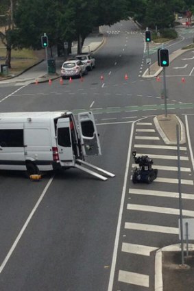 The bomb disposal robot deployed outside the Brisbane courts complex. Photo: Jess Millward, Nine News.