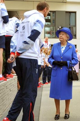 The Queen meets one of the taller members of the Great Britain team.