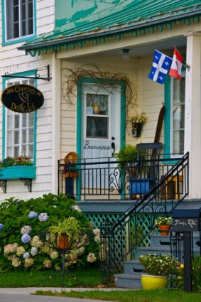 A quaint store in Saint-Jean village flies the state and national flags.