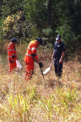 SES volunteers and police scan Sunshine Coast bushland for evidence.