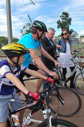 Transport minister Troy Buswell discusses the state government's $27.5 million bike route investment with cyclists today.