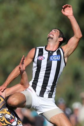 Collingwood's Brodie Grundy gets high and early in a ruck contest against Richmond in a pre-season match.