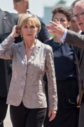 Australian Foreign Minister Julie Bishop with her Dutch counterpart Frans Timmermans as they attend a ceremony at Kharkiv airport during which coffins containing the remains of victims of MH17 are loaded into a transport plane heading for Eindhoven.