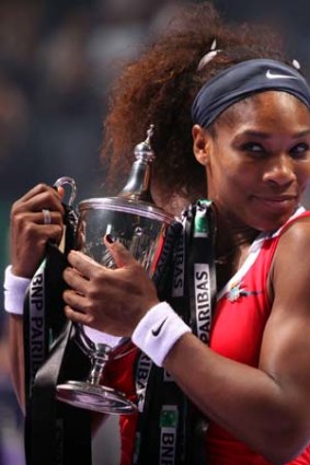 Untouchable ... Serena Williams holds the trophy after winning the WTA Championships.