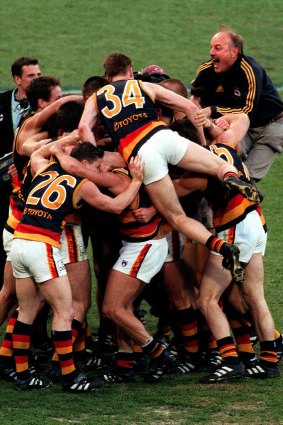 Malcolm Blight celebrates the 1998 Grand Final win with his Adelaide Crows players