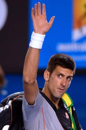See you in 2015: Novak Djokovic walks off sadly.