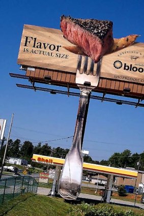 A rare sight, for now... the aroma of grilled beef wafts from this US billboard.