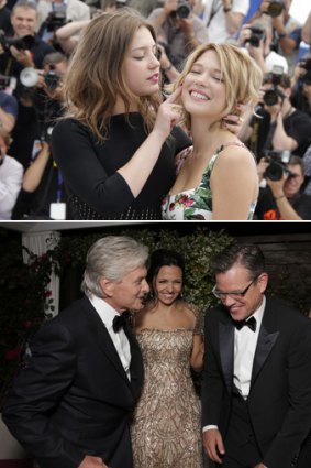 Off-screen performances: Lea Seydoux and Adele Exarchopoulos (above) put on a show at Cannes and (below) Michael Douglas and Matt Damon.
