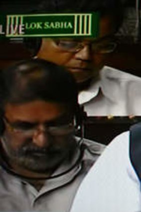 Pilloried: A TV image of Manmohan Singh addressing Parliament on Friday.