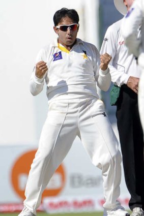 Saeed Ajmal reacts after taking a wicket.