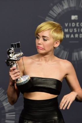Confusion: Miley Cyrus poses at the 2014 MTV Video Music Awards.