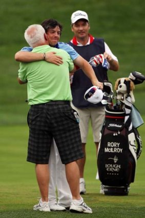 This one's for Pa ... McIlroy hugs dad Gerry.