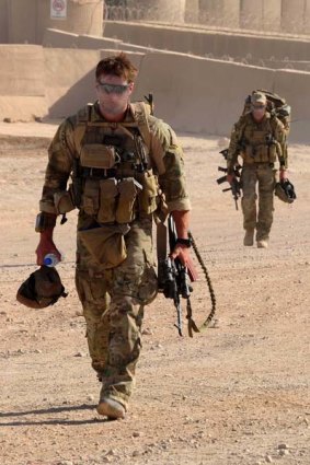 Special Operations Task Group soldiers wearing the Multicam combat uniform make their way from Camp Russell to the airfield at Multi National Base Tarin Kowt before an operation in Kandahar province.