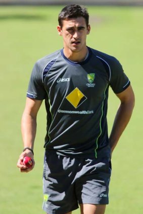 Carrying the drinks again: Mitchell Starc.