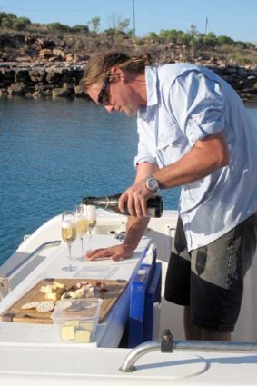 Paspaley Pearls' Ben Hawkins pours drinks.