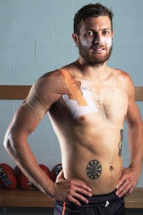Getting the jab done &#8230; diabetic Sam Reid shows his insulin-injection target; inset, the dartboard tattoo.