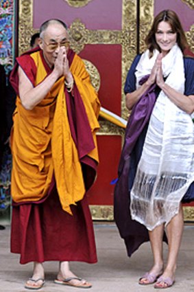 Tibetan spiritual leader Dalai Lama and France's first lady Carla Bruni-Sarkozy.