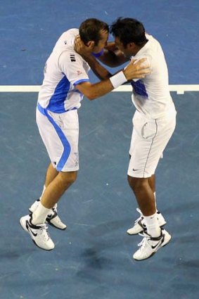 Radek Stepanek and Leander Paes celebrate winning the mens' doubles final.