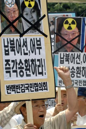 Protesters chant anti-North Korea slogans at a rally in Seoul.