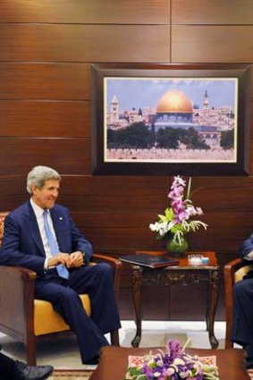 Diplomacy: John Kerry (left) with Mahmoud Abbas.
