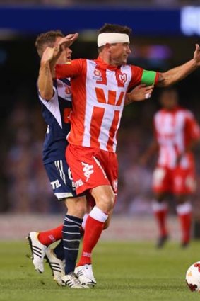 Harry Kewell is fouled by Leigh Broxham of the Victory.