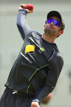 Nathan Lyon gives it a tweak in the nets at the Gabba.