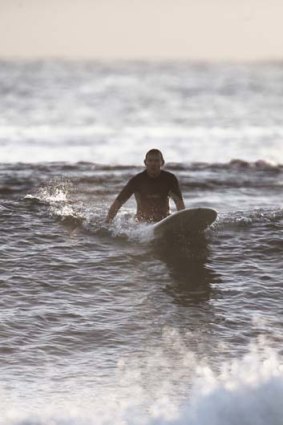 The Prime Minister Tony Abbott surfing at North Steyne.