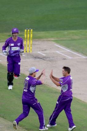 Hobart Hurricanes skipper George Bailey high-fives Cameron Boyce after he trapped Stars opener Luke Wright (right) lbw for 13.