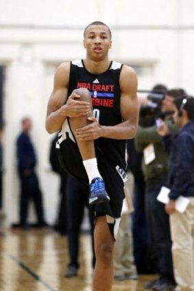 Dante Exum stretches before participating in the NBA draft combine.