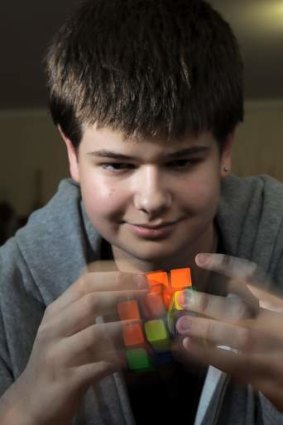 Rubiks cube exponent, 14 year old Jayden McNeill at his home in Weston on Wednesday.