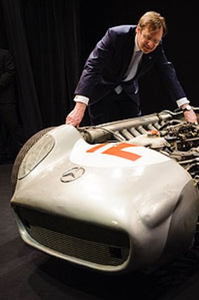 Bonhams chairman Robert Brooks inspects the 1954 Mercedes-Benz racer that could fetch more than $7 million at auction.