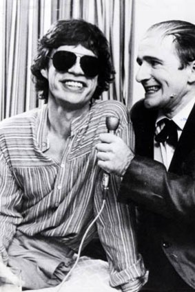 Norman Gunston (Garry McDonald) with Mick Jagger.