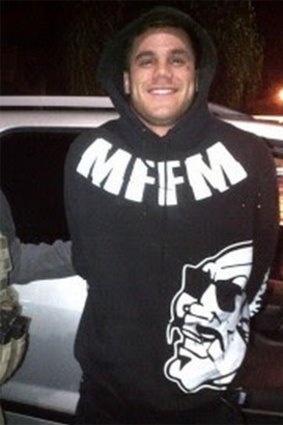 Wade Yates-Taui is arrested in the United States, wearing a jumper bearing the motto Mongols Forever, Forever Mongols.