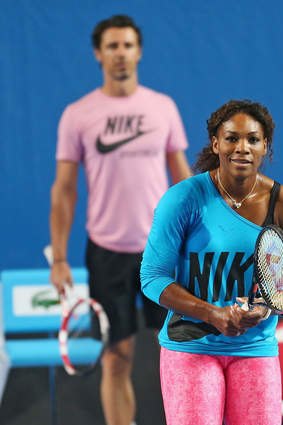 Courting success: Serena Williams, watched by French coach and beau Patrick Mouratoglou, practises at Melbourne Park ahead of the Australian Open.