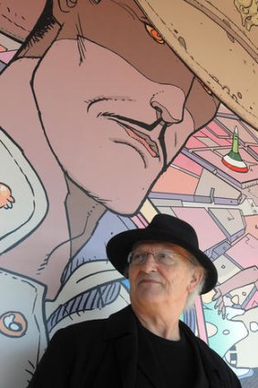 Jean Giraud, aka "Moebius", in front of a fresco made from one of his albums, in 2008.