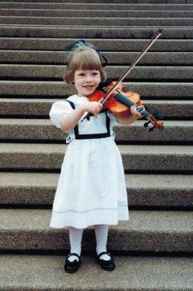 Frocked up: Lucy Cormack, 4, ready to play in the concert hall.