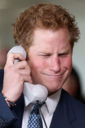 Prince Harry  takes part in a trade on at the BGC Partners trading floor  in London, on September 11, 2013.