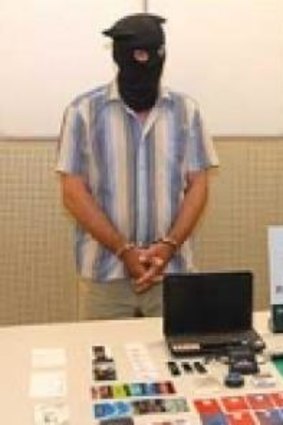 Two men arrested in Macau for allegedly planting malware on local ATMs (shown with equipment reportedly seized from their hotel room).