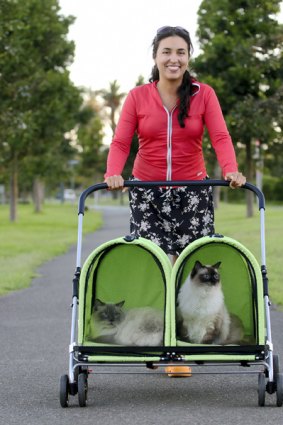 ‘‘I don’t care what people think’’  ... Eliana Marino takes Pepe and Maya for a stroll in Centennial Park.