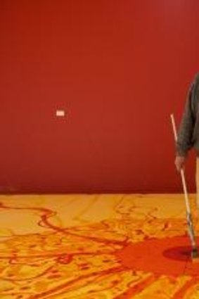 Creature of contradiction: John Olsen working on a mural at his Southern Highlands home in 2013.