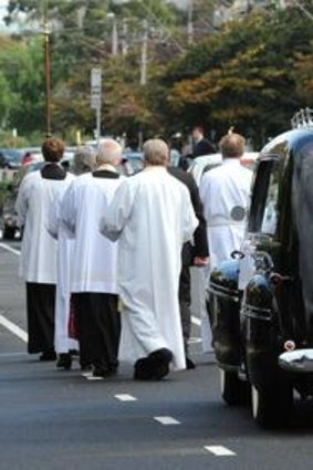 The hearse leaves St. Silas' church.