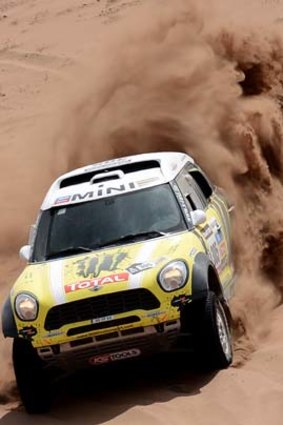 Spaniard Joan Nani Roma steers his Mini during Stage 12 of the 2013 Dakar Rally between Fiambala in Argentina and Copiapo in Chile. Roma won the stage despite a late tyre blow-out.