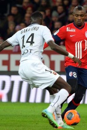 Lille forward Salomon Kalou (right) vies for the ball with Rennes' midfielder Tiemoue Bakayoko.