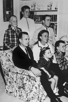 In this 1964 file photo, George H W Bush sits on couch with his wife Barbara and their children. George W Bush sits at right behind his mother. Behind the couch are Neil and Jeb Bush. Sitting with their parents are Dorothy and Marvin Bush.
