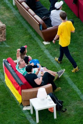 Fans enjoy the game at the Alte Foersterei stadium in Berlin.